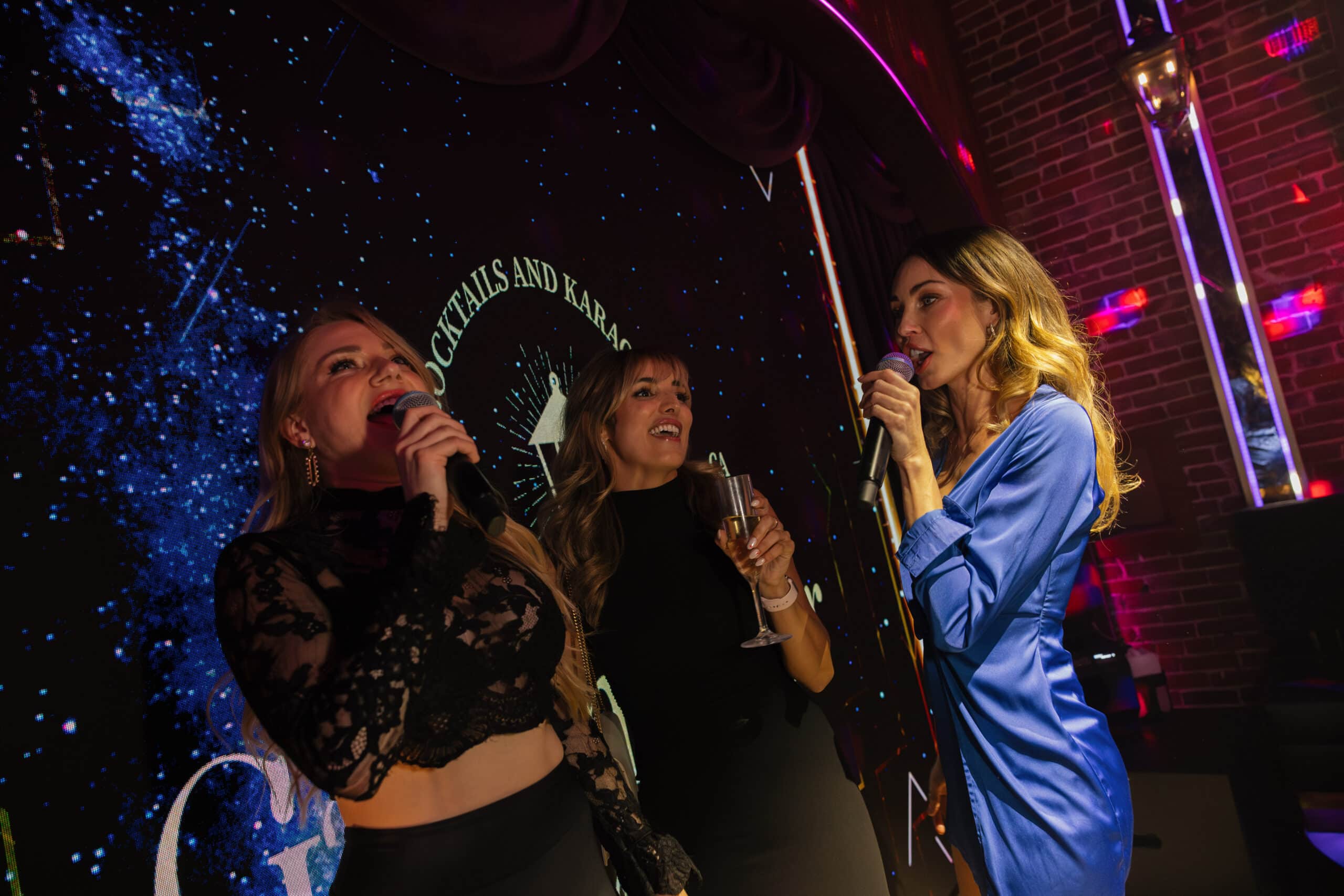 Karaoke stage with a vintage microphone at a cocktail bar in San Diego's Gaslamp Quarter