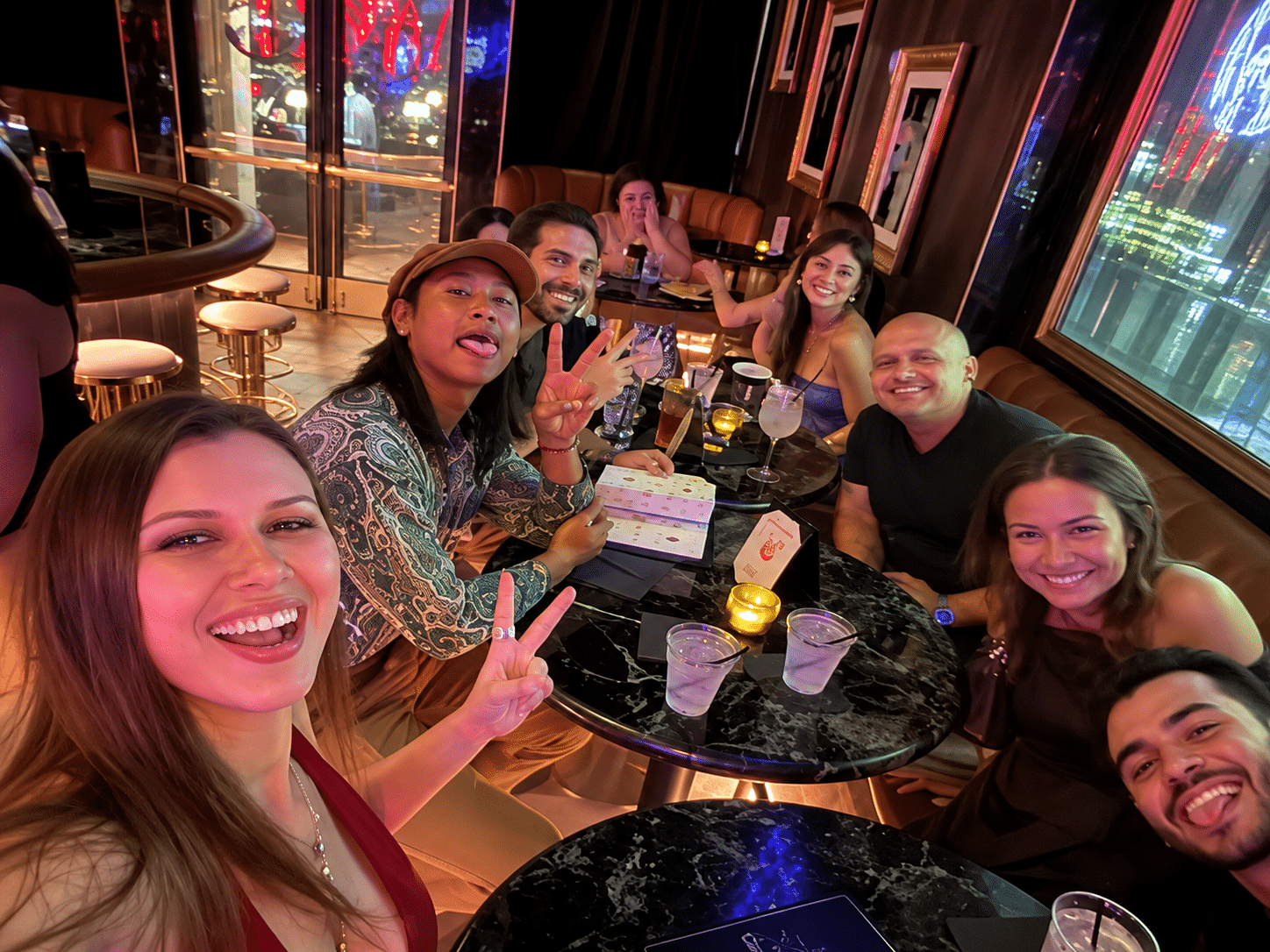 Smartphone recording a lit karaoke stage, capturing a potential viral karaoke moment